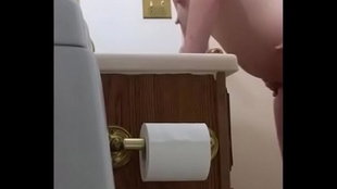 Wild beauty gets fucked in the bathroom with a hidden webcam